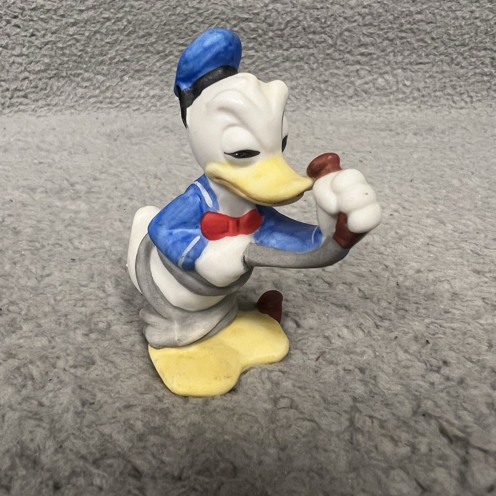 VTG Walt Disney Production 3" Donald Duck Holding Hose Bisque Porcelain Figurine